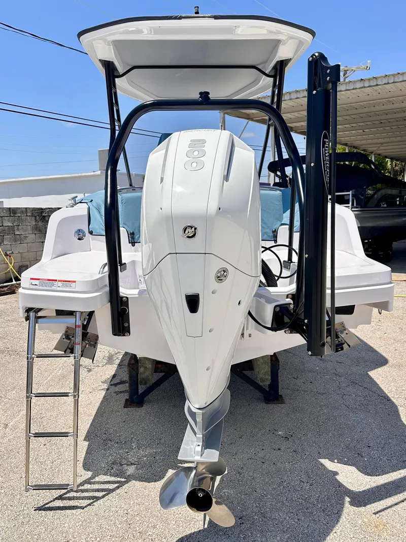 Slide: The Image of 2022 Axopar 22 T-Top boat with outboard motor, rear view. - 6