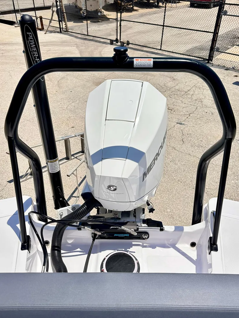 Slide: The Image of 2022 Axopar 22 T-Top boat with Mercury engine, rear view. - 9