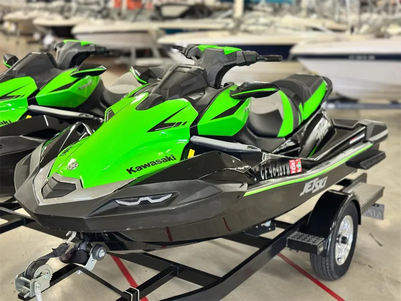 The Image of 2023 Kawasaki Jetski Ultra 310LX-S in vibrant green on a trailer. - 0