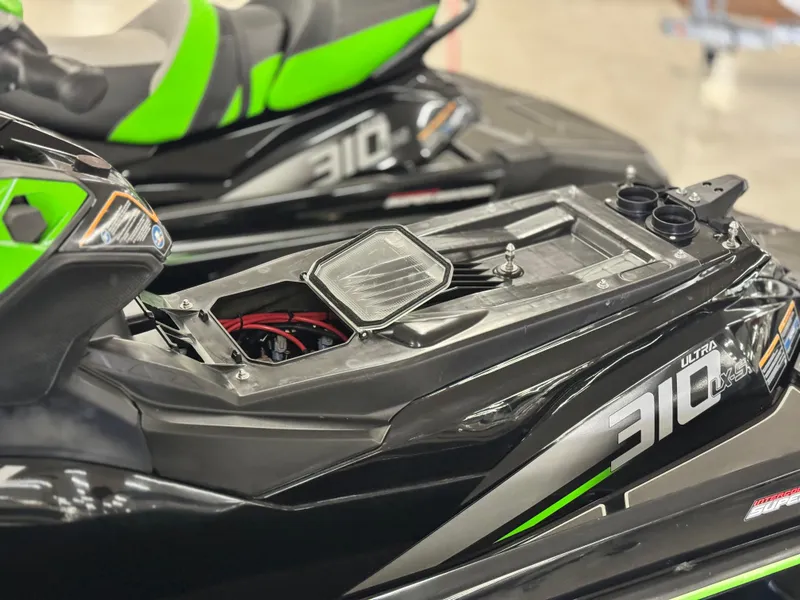 Slide: The Image of 2023 Kawasaki Jetski Ultra 310LX-S with open storage compartment, showcasing sleek design. - 13