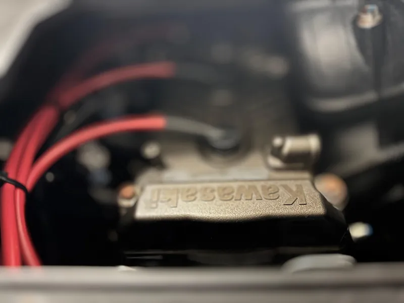 Slide: The Image of Close-up of 2023 Kawasaki Jetski Ultra 310LX-S engine with red cables. - 14