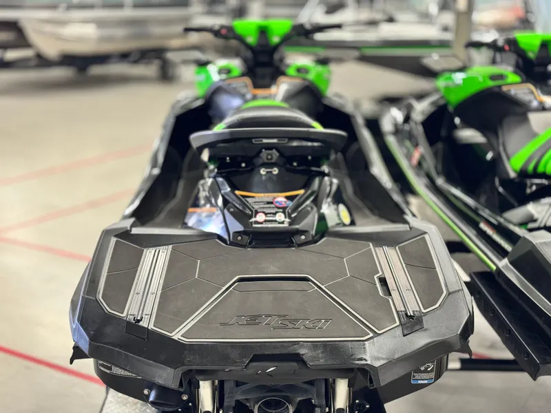Slide: The Image of 2023 Kawasaki Jetski Ultra 310LX-S, green and black, rear view in showroom. - 4