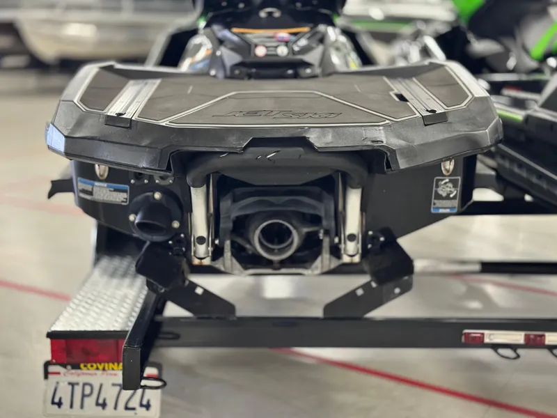 Slide: The Image of 2023 Kawasaki Jetski Ultra 310LX-S on trailer, rear view in garage setting. - 5