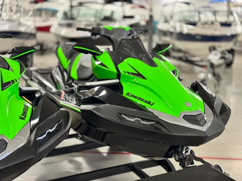 Slide: The Image of 2023 Kawasaki Jetski Ultra 310LX-S in vibrant green, displayed in a showroom. - 7