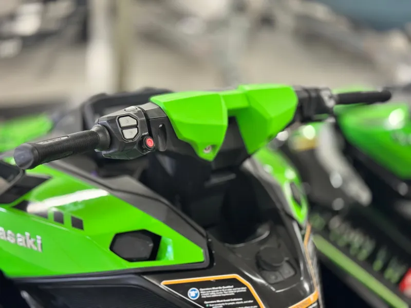 Slide: The Image of 2023 Kawasaki Jetski Ultra 310LX-S, green handlebars, close-up view. - 9