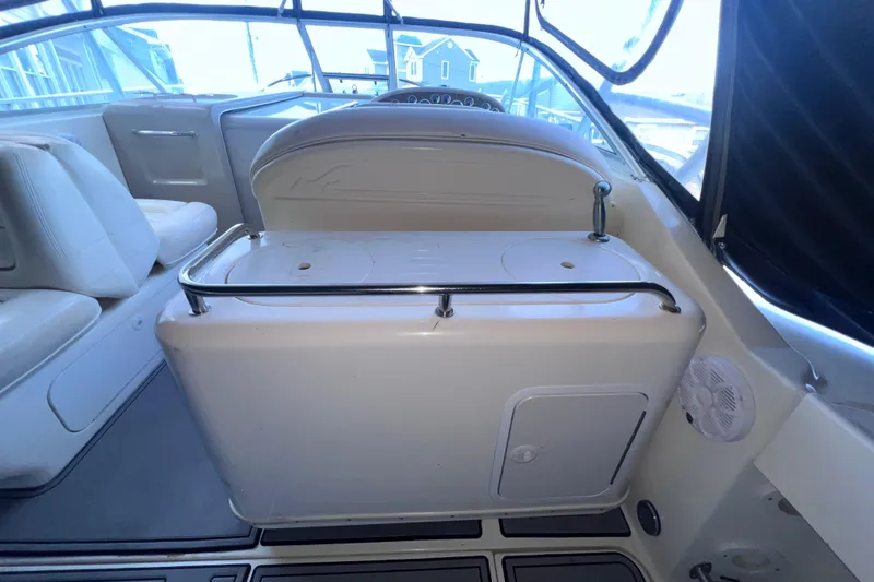 Slide: The Image of 2000 Sea Ray 290 Amberjack boat interior with seating and storage area. - 9