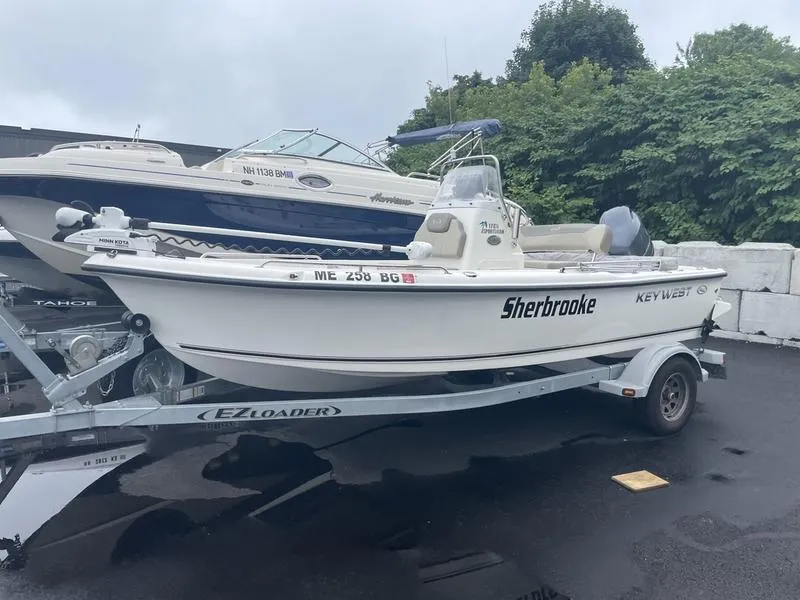 The Image of 2023 Key West 1720 CC boat on trailer, parked outdoors. - 0