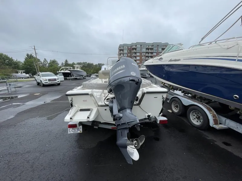 Slide: The Image of 2023 Key West 1720 CC boat with Yamaha outboard motor in a parking lot. - 4