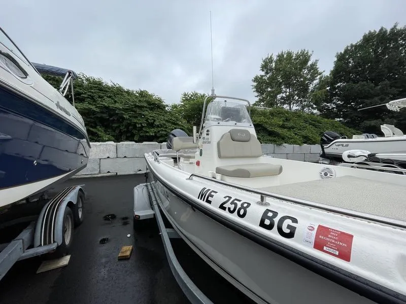 Slide: The Image of 2023 Key West 1720 CC boat on trailer, parked outdoors, overcast sky. - 7