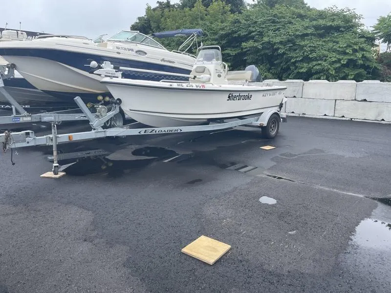 Slide: The Image of 2023 Key West 1720 CC boat on trailer in parking lot. - 8