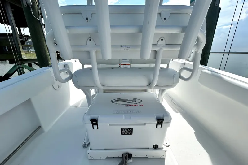 Slide: The Image of 2017 Sea Hunt Ultra 235 SE boat interior with seating and storage. - 11