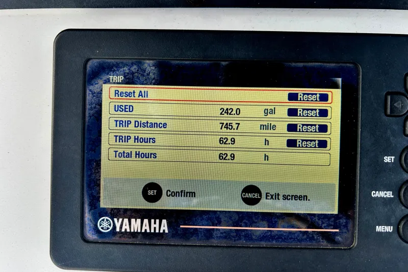Slide: The Image of Yamaha display showing trip data: 242 gallons used, 745.7 miles, 62.9 hours on Sea Hunt Ultra 235 SE. - 20
