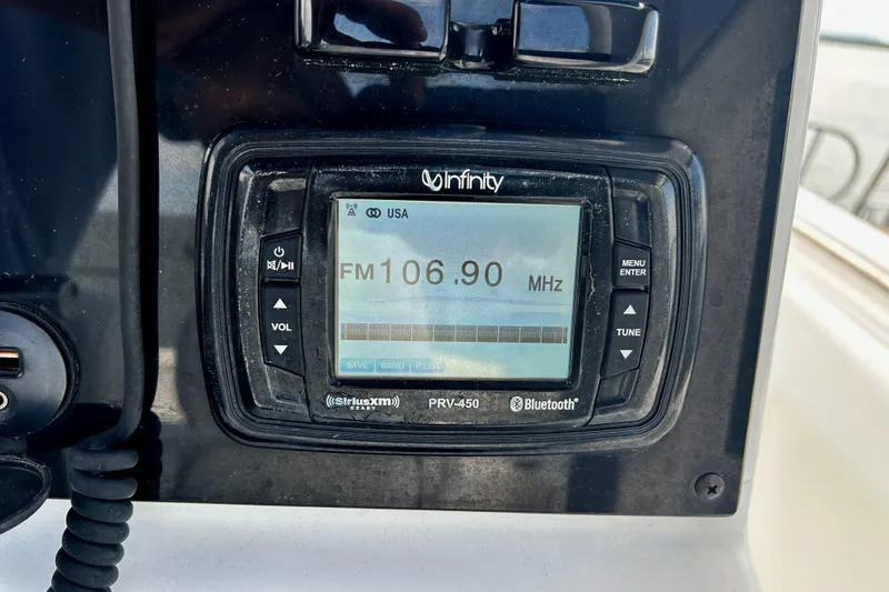 Slide: The Image of Infinity marine radio display on 2017 Sea Hunt Ultra 235 SE, tuned to FM 106.9 MHz. - 21