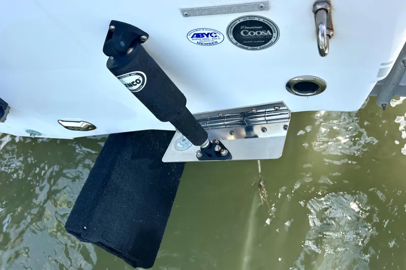 Slide: The Image of 2017 Sea Hunt Ultra 235 SE boat with trim tab and water reflection. - 26