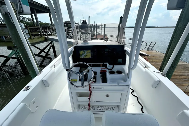 Slide: The Image of 2017 Sea Hunt Ultra 235 SE boat cockpit with steering wheel and navigation system. - 5