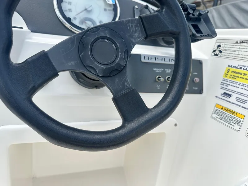 Slide: The Image of Steering wheel of 2015 Bayliner Element 180 XL boat with dashboard controls. - 18