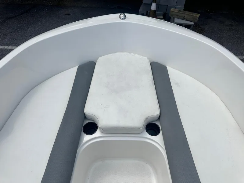 Slide: The Image of 2015 Bayliner Element 180 XL boat interior with seating and cup holders. - 27