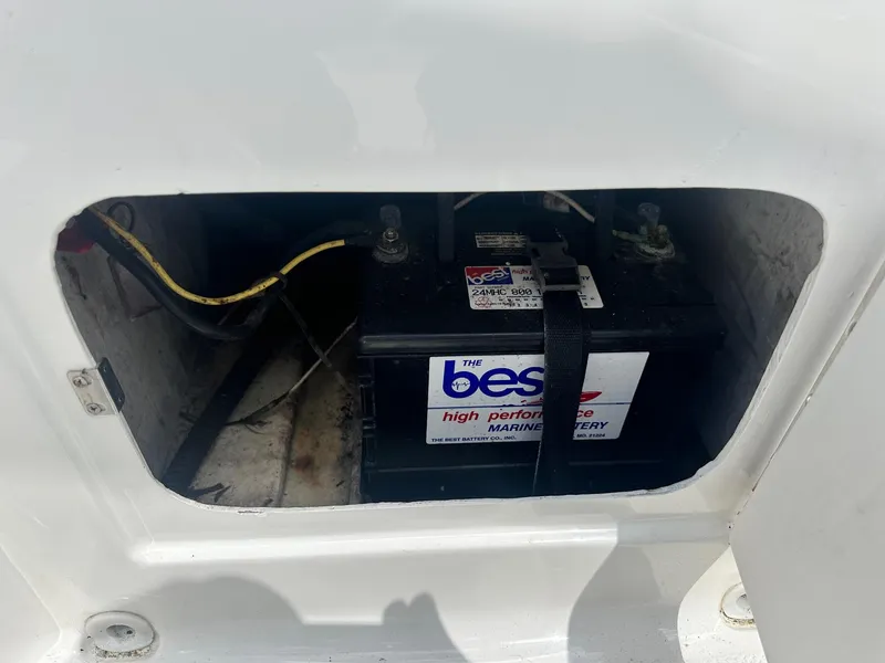 Slide: The Image of Battery compartment of 2015 Bayliner Element 180 XL boat, featuring a high-performance marine battery. - 28