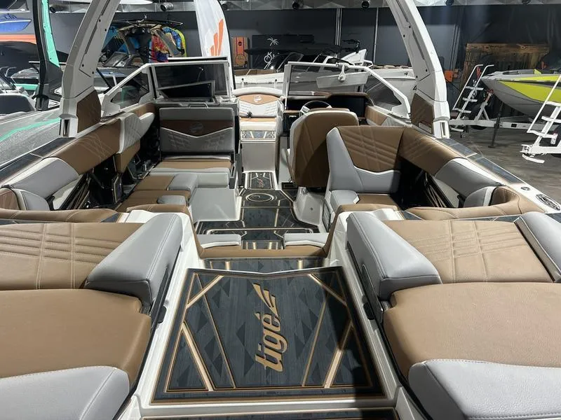 Slide: The Image of 2025 Tigé Ultré 23ZX boat interior with luxurious seating and modern design. - 2