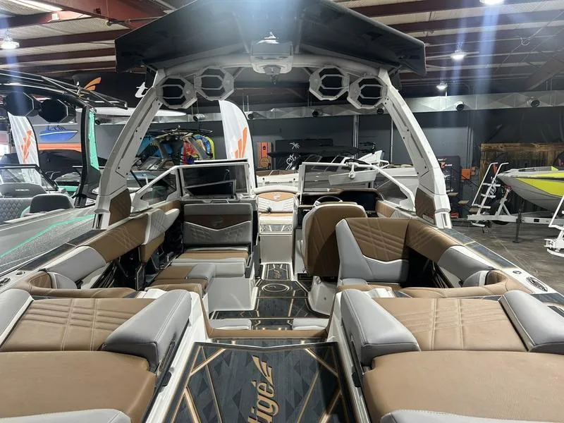 Slide: The Image of 2025 Tigé Ultré 23ZX boat interior with luxurious seating and advanced audio system. - 3