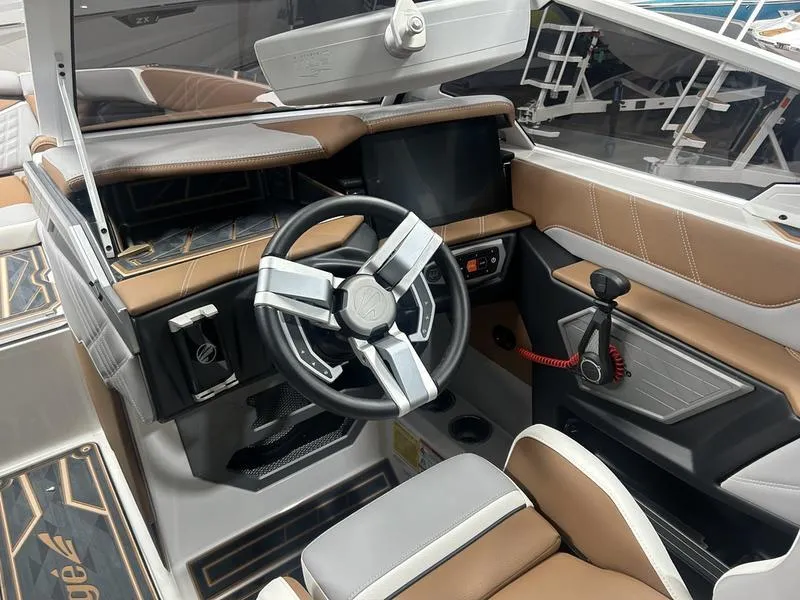 Slide: The Image of 2025 Tigé Ultré 23ZX boat interior with modern steering wheel and dashboard. - 5