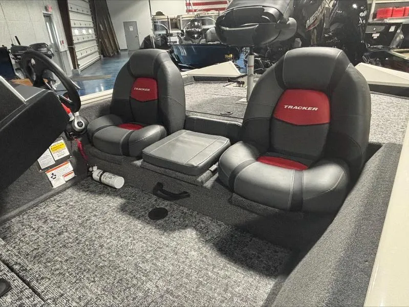 Slide: The Image of 2025 Tracker PT 175 TXW boat interior with dual black and red seats. - 10