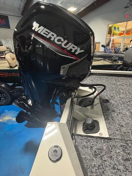 Slide: The Image of 2025 Tracker PT 175 TXW boat with Mercury outboard motor in showroom. - 5