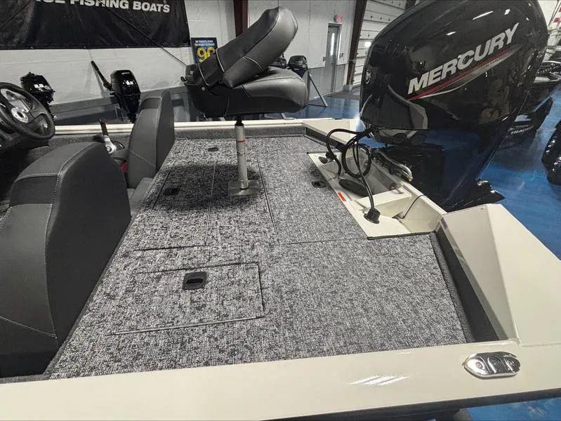 Slide: The Image of 2025 Tracker PT 175 TXW fishing boat with Mercury engine, featuring spacious seating and storage. - 6