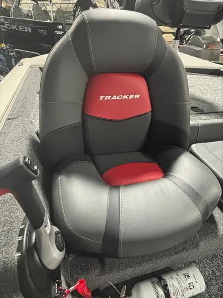 Slide: The Image of 2025 Tracker PT 175 TXW boat seat, black and red design, with steering control. - 8