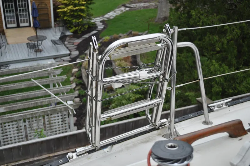 Slide: The Image of Stainless steel ladder on 1984 Catalina 36 Tall Rig sailboat deck, with garden view. - 21