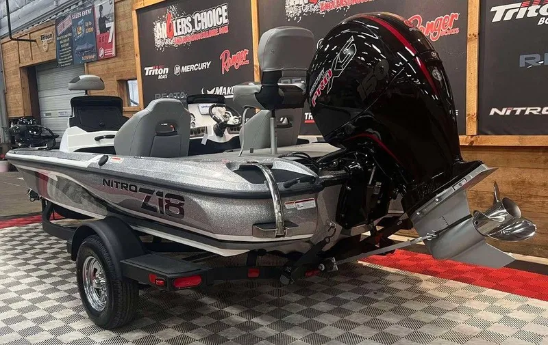 Slide: The Image of 2025 Nitro Z18 boat with powerful outboard motor in showroom setting. - 3
