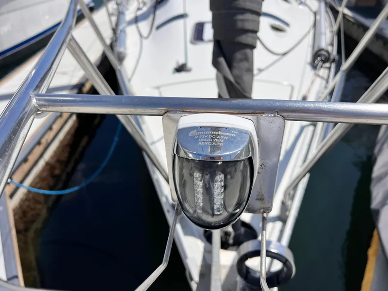 Slide: The Image of Bow view of a 1990 Beneteau First 41s5 sailboat, featuring stainless steel railing. - 12