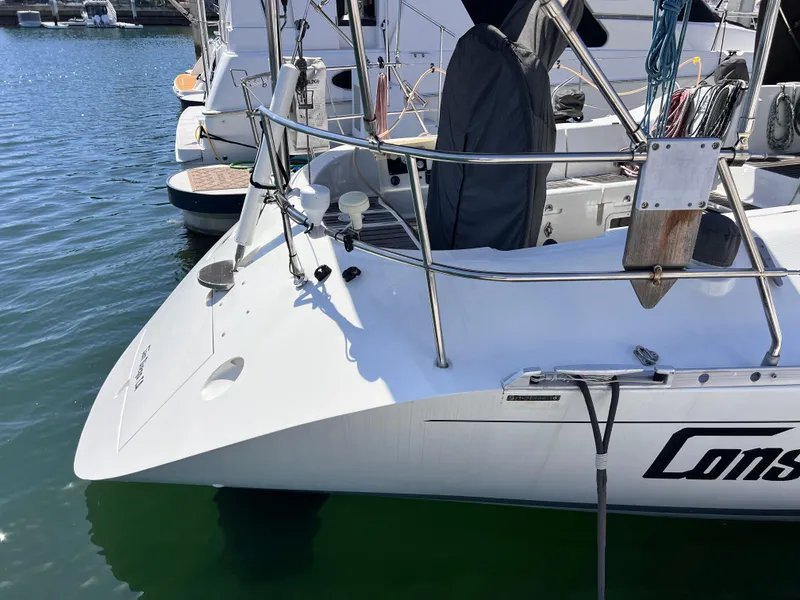 Slide: The Image of Sailboat Beneteau First 41s5, 1990 model, docked in marina, showing deck and railing. - 15