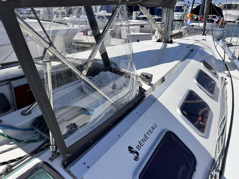 Slide: The Image of Beneteau First 41s5 sailboat, 1990 model, docked with clear windows and sleek design. - 17