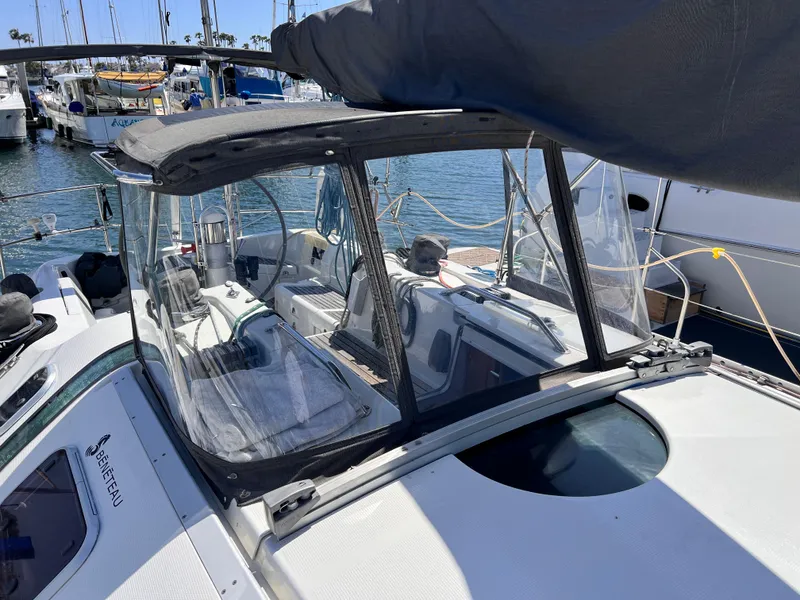 Slide: The Image of Sailboat Beneteau First 41s5, 1990 model, docked in marina with clear cockpit enclosure. - 18