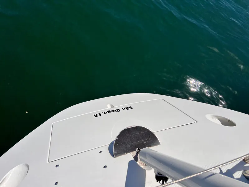 Slide: The Image of Beneteau First 41s5 sailboat stern view, 1990 model, on calm green water. - 19