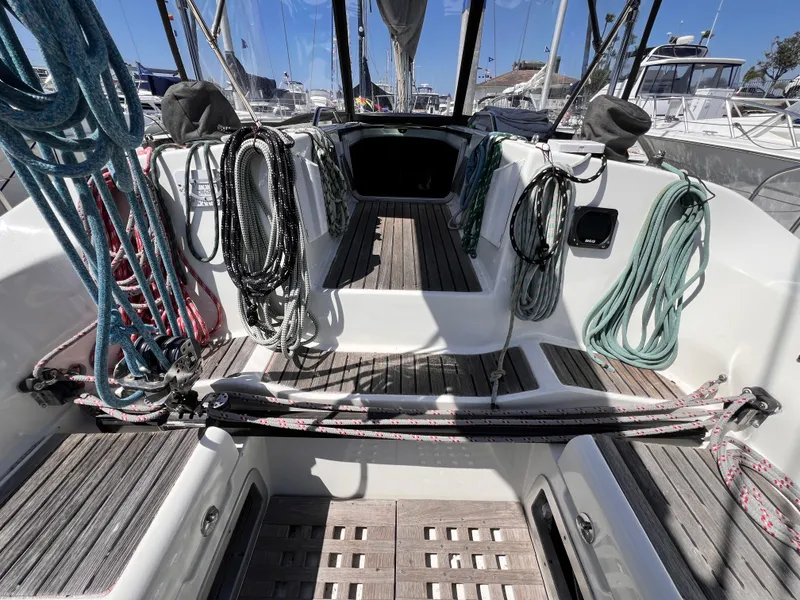 Slide: The Image of Cockpit of 1990 Beneteau First 41s5 sailboat with ropes and wooden flooring. - 22