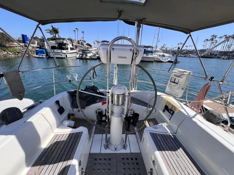 Slide: The Image of Cockpit view of 1990 Beneteau First 41s5 sailboat docked in a marina. - 23