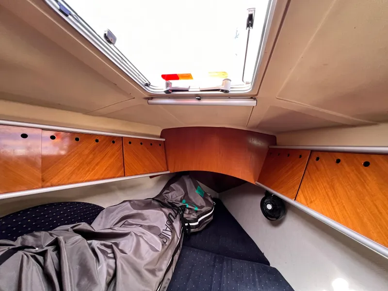 Slide: The Image of Interior cabin of 1990 Beneteau First 41s5 sailboat with wood paneling and hatch. - 46