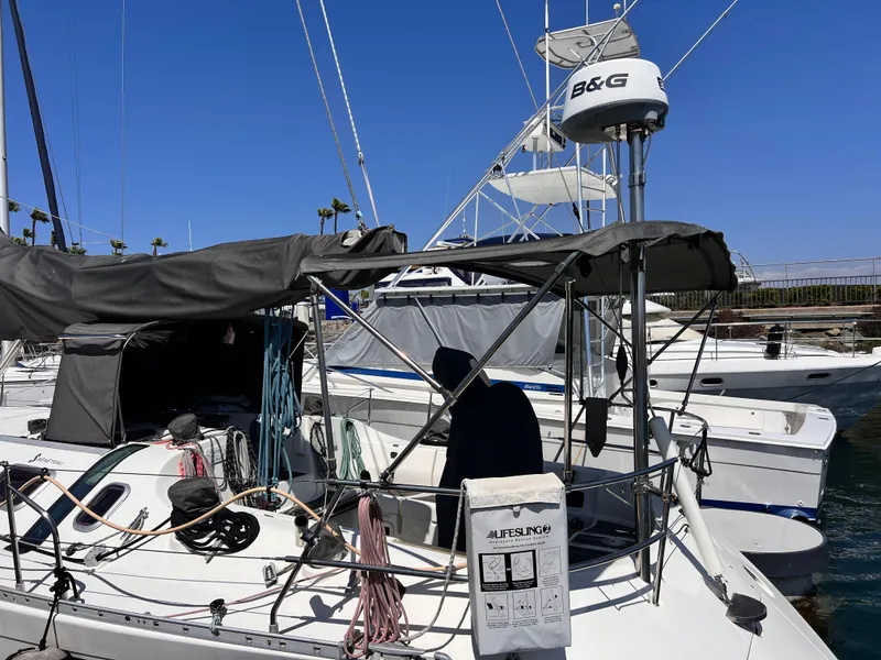 Slide: The Image of Beneteau First 41s5 sailboat, 1990 model, docked with visible rigging and equipment. - 7