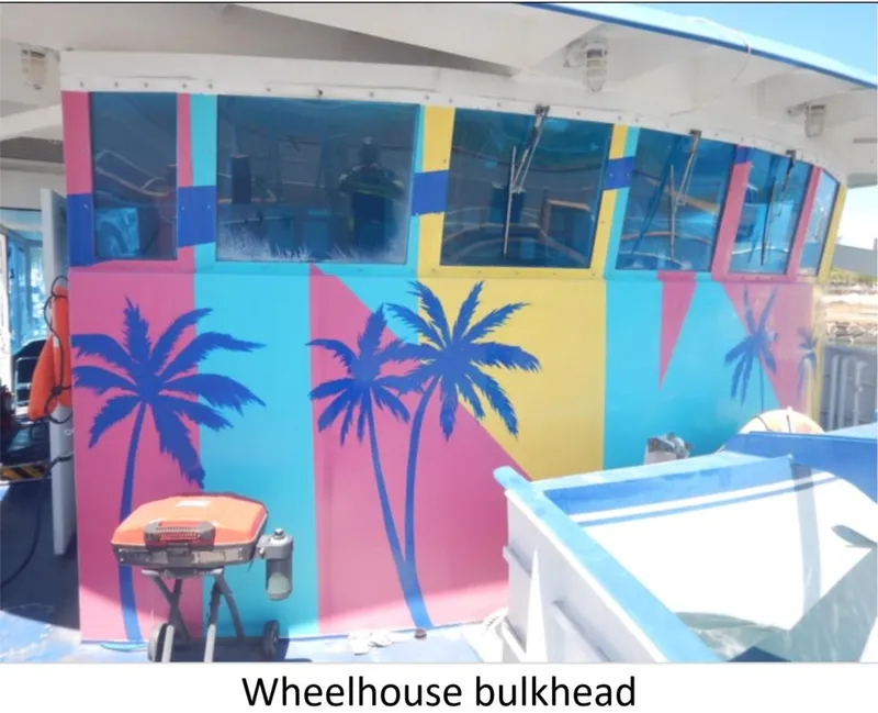 Slide: The Image of Colorful wheelhouse bulkhead with palm tree design on a 2010 Custom Semi Sub Power Catamaran. - 11