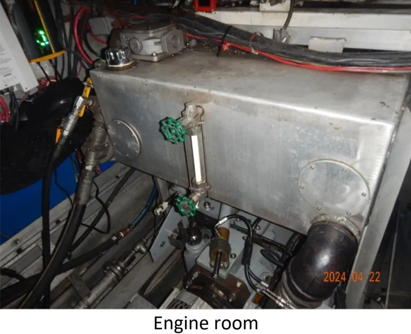 Slide: The Image of Engine room of 2010 Custom Semi Sub Power Catamaran with visible machinery and pipes. - 18