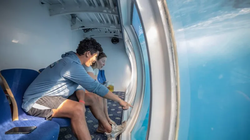 Slide: The Image of Couple enjoying underwater view from 2010 Custom Semi Sub Power Catamaran. - 2