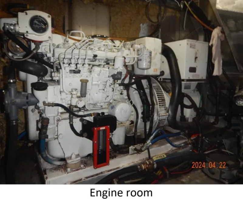 Slide: The Image of Engine room of 2010 Custom Semi Sub Power Catamaran with visible machinery and components. - 21