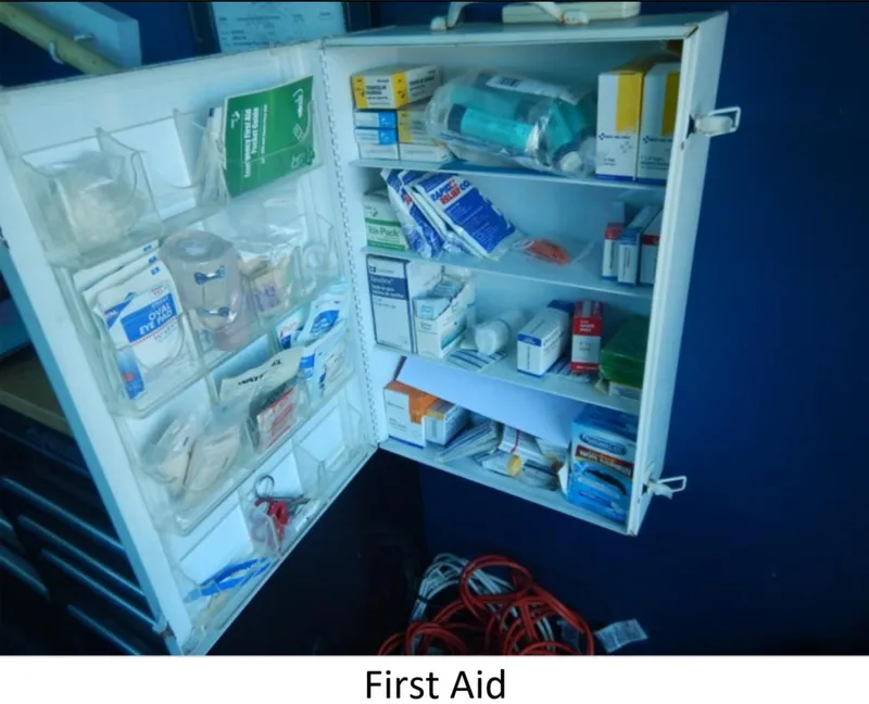 Slide: The Image of First aid cabinet on a 2010 Custom Semi Sub Power Catamaran, stocked with medical supplies. - 24
