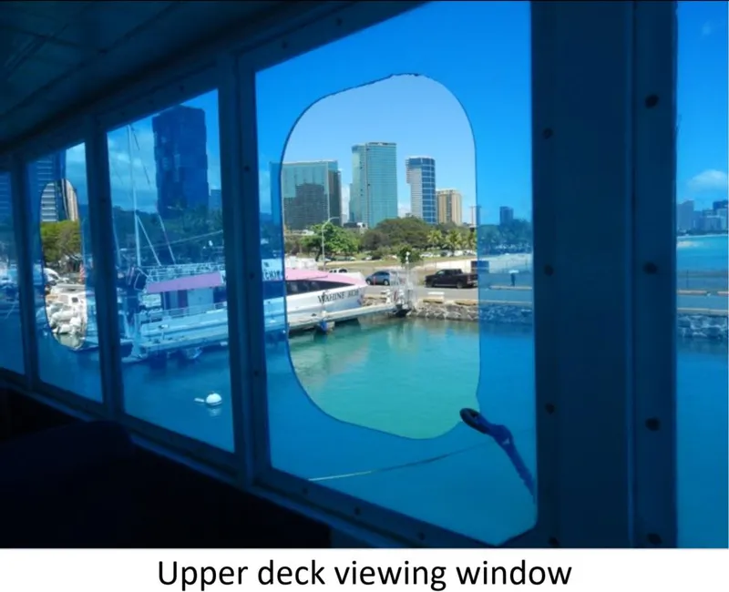 Slide: The Image of Upper deck view from 2010 Custom Semi Sub Power Catamaran, showcasing city skyline and harbor. - 3