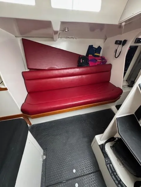 Slide: The Image of Interior of 1985 Farr PERFORMANCE yacht with red seating and modern design elements. - 22