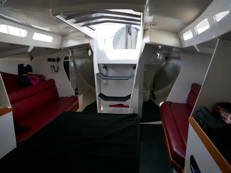 Slide: The Image of Interior of 1985 Farr PERFORMANCE sailboat with red seating and modern design. - 26