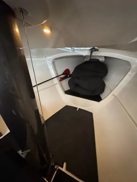 Slide: The Image of Interior of 1985 Farr PERFORMANCE sailboat, featuring a compact cabin with sleeping area. - 30