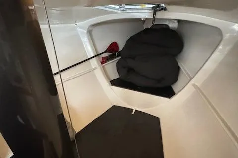 Slide: The Image of Interior of 1985 Farr PERFORMANCE sailboat, featuring storage space and equipment. - 31